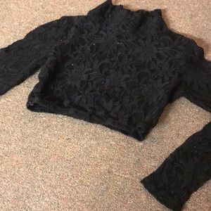 Black shimmery black crop top with long sleeves